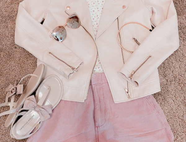 pink pleather jacket with pink shorts, pink bow, ted baker sandal dupes, a white floral tee shirt with pink cat eye sunglasses, and a pearl headband