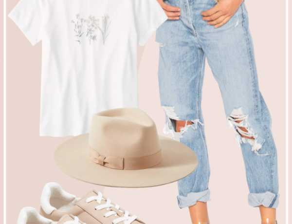 feminine spring outfit with high waisted distressed jeans and blush pink sneakers with a floral print tee shirt and light tan fedora hat