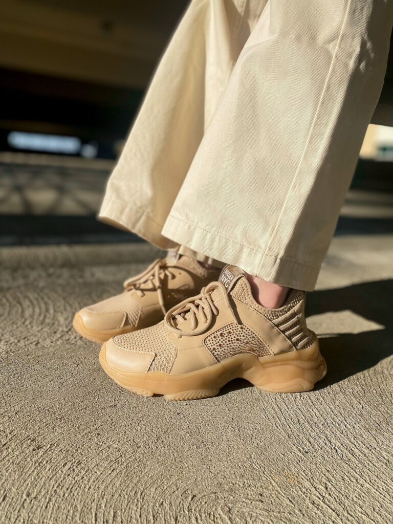 Walmart style influencer wearing beige madden nyc chunky sneakers